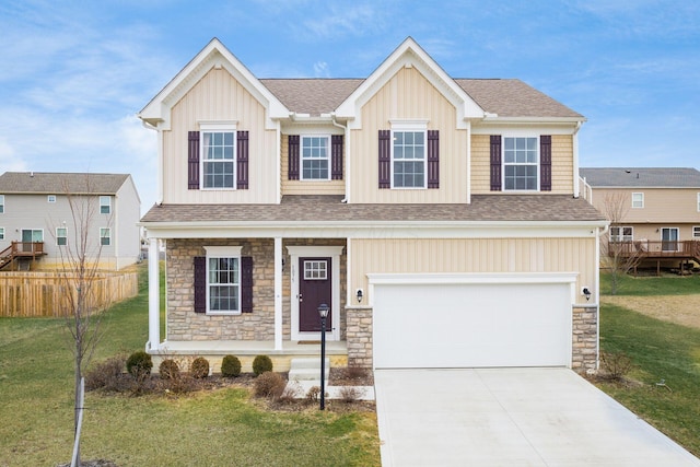 view of front of property with a garage and a front lawn