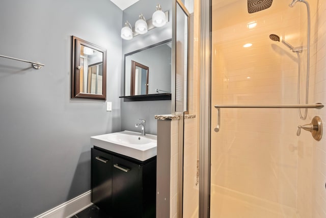 bathroom with vanity and a shower with shower door