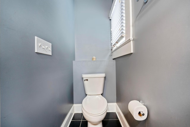 bathroom with tile patterned floors and toilet