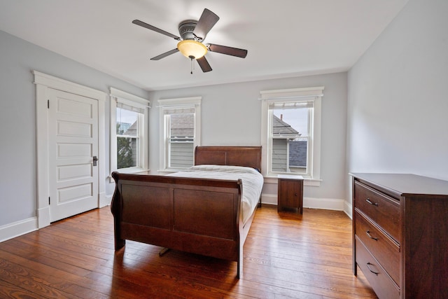 bedroom with hardwood / wood-style flooring and ceiling fan