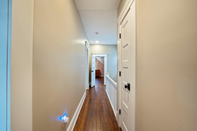 corridor featuring dark hardwood / wood-style flooring