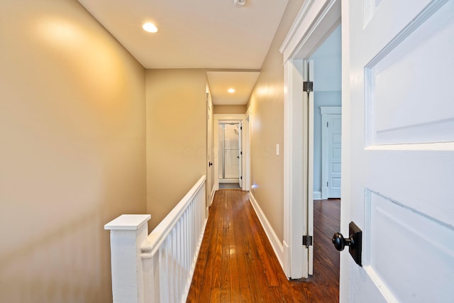 hallway with dark hardwood / wood-style floors