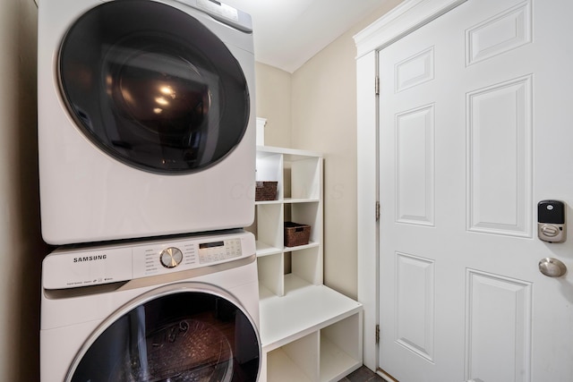 laundry room featuring stacked washer and dryer