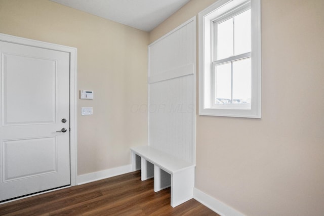 mudroom featuring dark wood-style floors and baseboards