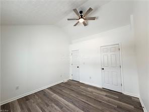 unfurnished room featuring ceiling fan, lofted ceiling, and dark hardwood / wood-style flooring