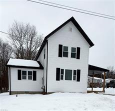 view of snow covered house