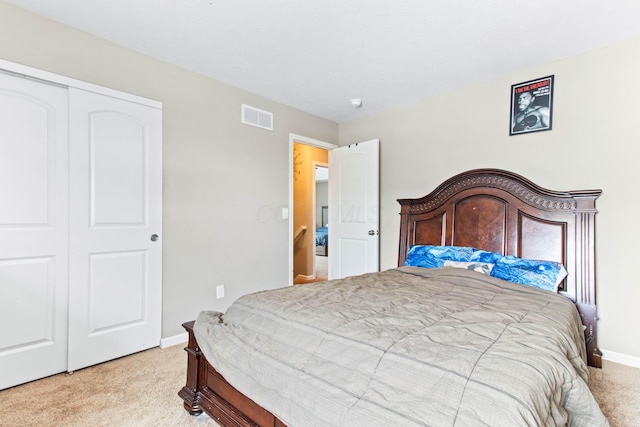 carpeted bedroom with a closet