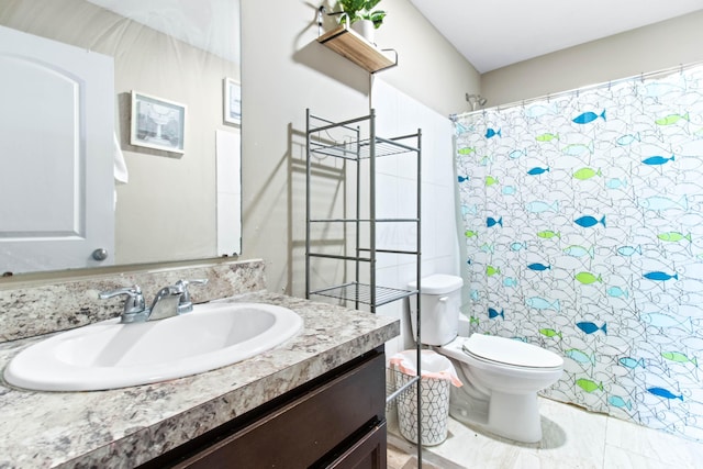 bathroom featuring vanity, walk in shower, and toilet