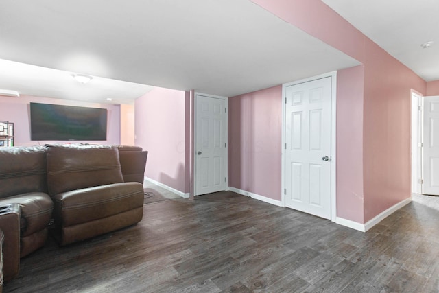 unfurnished living room featuring dark hardwood / wood-style floors