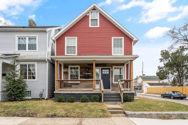 view of front of home featuring a porch and a front lawn