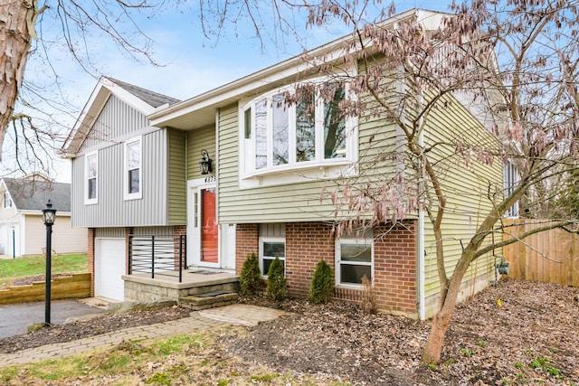 split foyer home featuring a garage