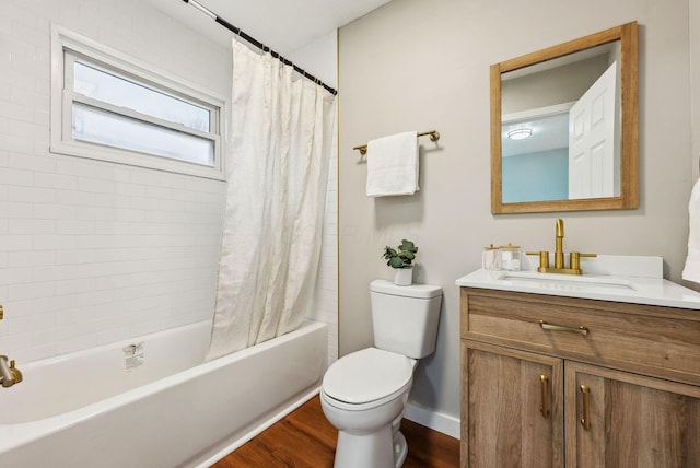 full bathroom with wood-type flooring, toilet, shower / tub combo, and vanity