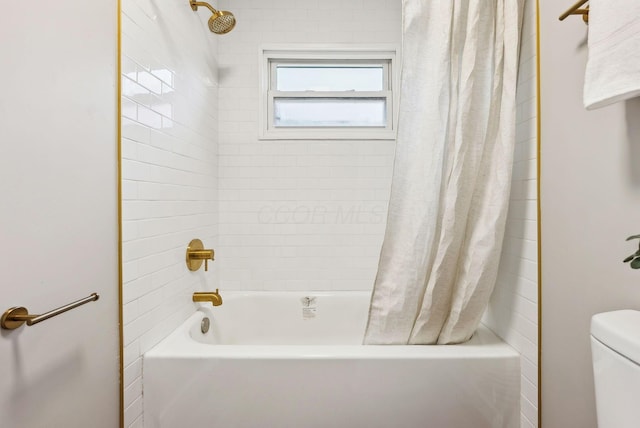 bathroom with toilet and shower / bath combo with shower curtain