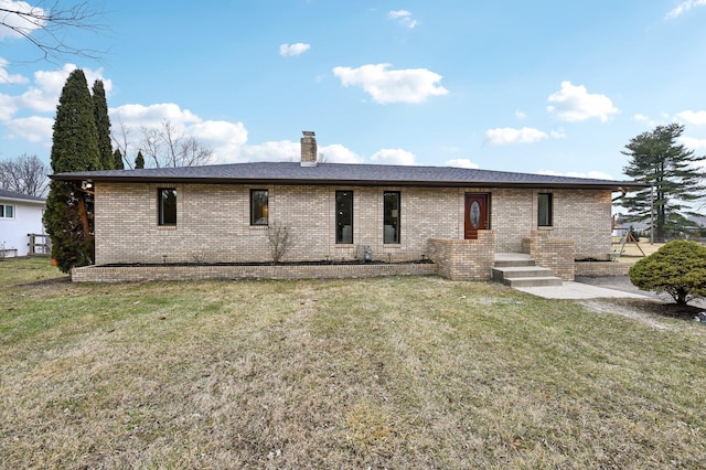 back of house with a yard