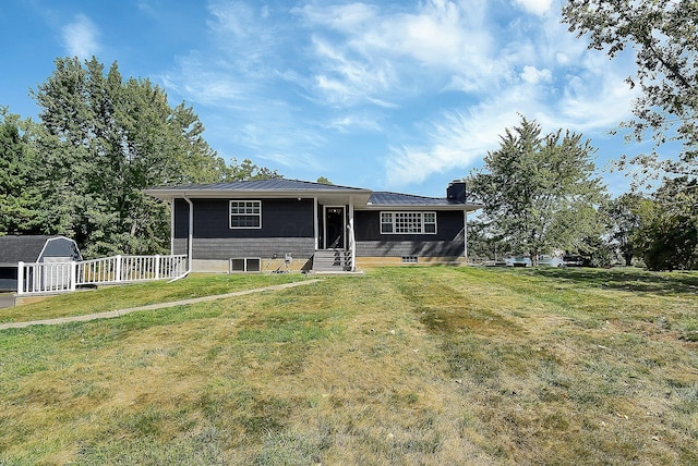 view of front of home with a front lawn