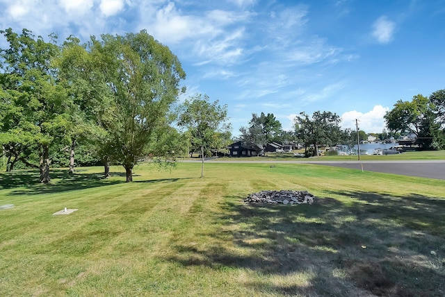 view of property's community with a lawn