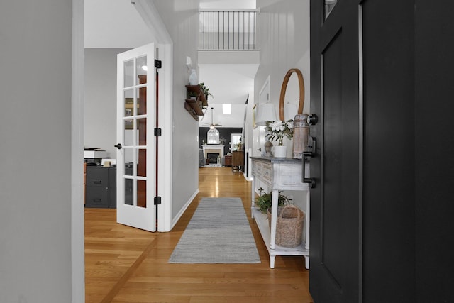 entrance foyer featuring a towering ceiling and hardwood / wood-style floors