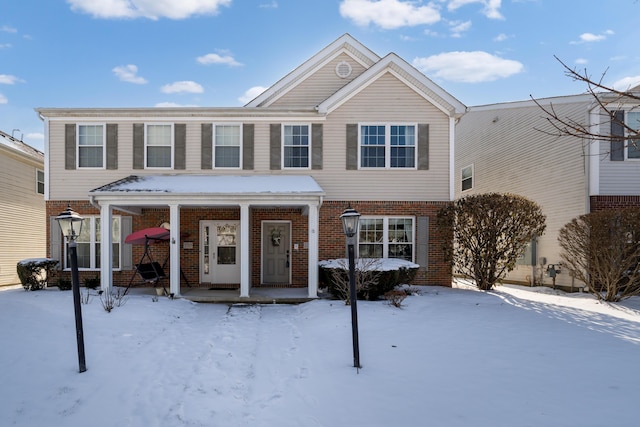 view of front of house featuring brick siding