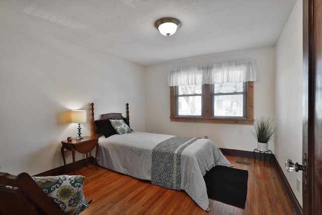 bedroom featuring dark wood-type flooring