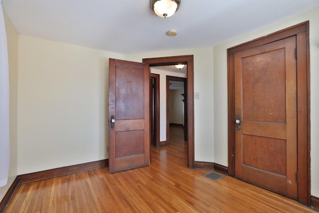 spare room featuring light wood-type flooring