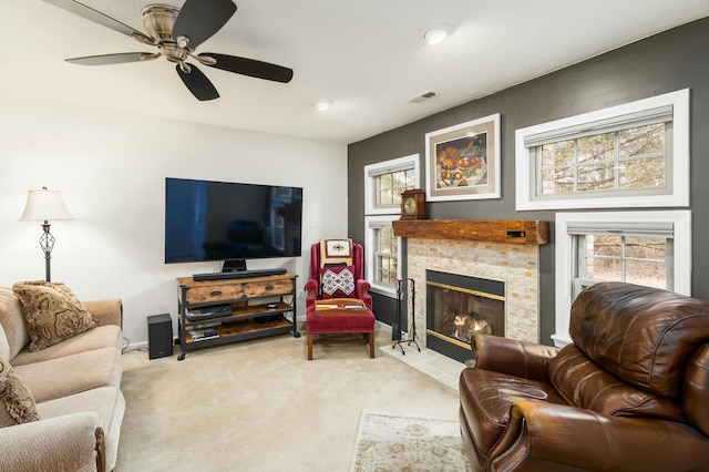 carpeted living room with ceiling fan