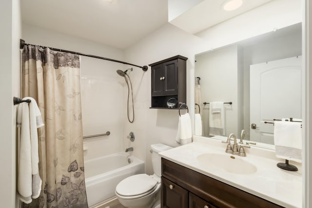 full bathroom with shower / bath combination with curtain, vanity, and toilet