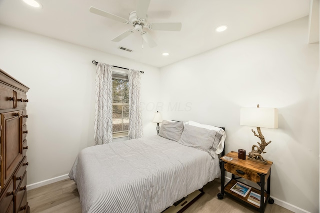 bedroom featuring ceiling fan and light hardwood / wood-style floors