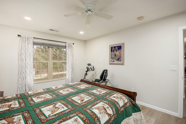 bedroom with ceiling fan and light wood-type flooring