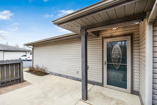 entrance to property with a patio