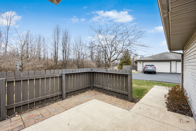 view of patio featuring a garage