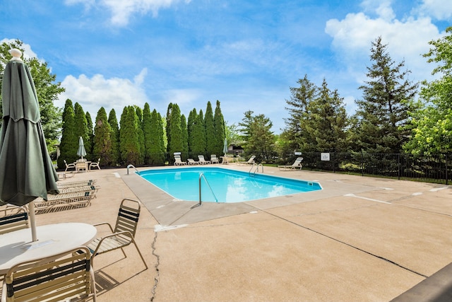 view of swimming pool featuring a patio area