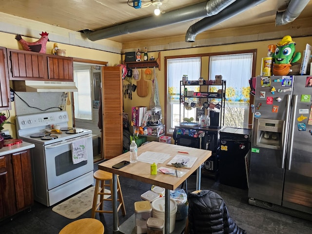 kitchen with white electric stove, stainless steel fridge, and beam ceiling