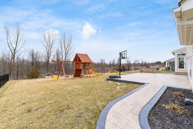 view of yard with a playground and a patio