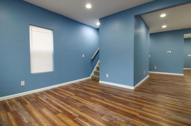 spare room featuring dark wood-type flooring