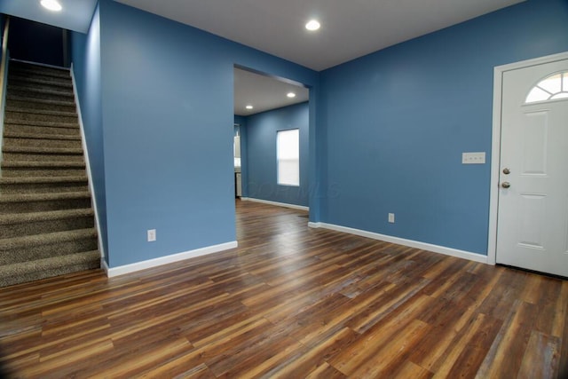 foyer with dark hardwood / wood-style floors