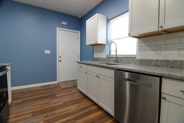 kitchen with dark wood-type flooring, sink, tasteful backsplash, dishwasher, and white cabinets