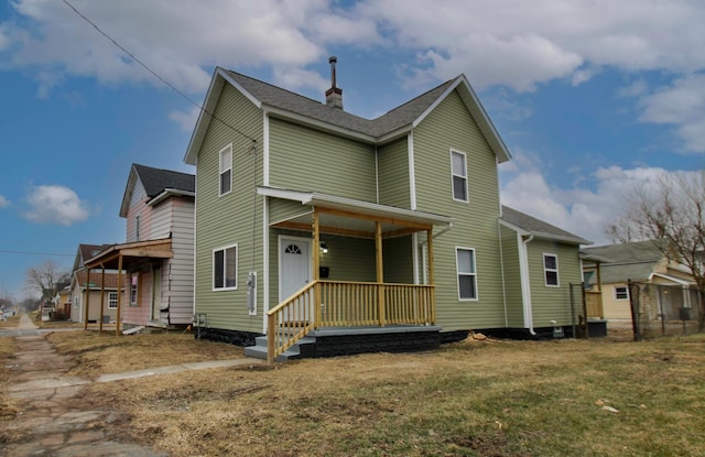 exterior space featuring a yard and covered porch