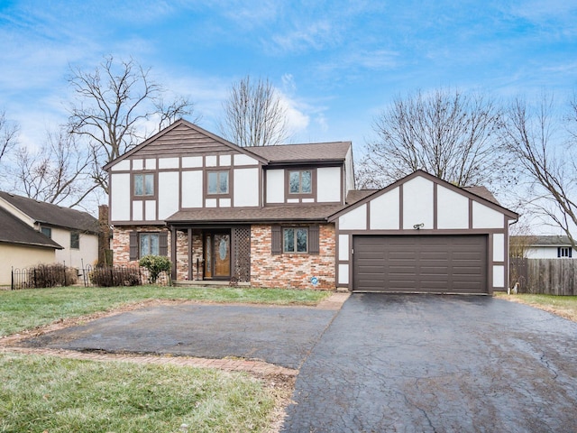 tudor home featuring a garage