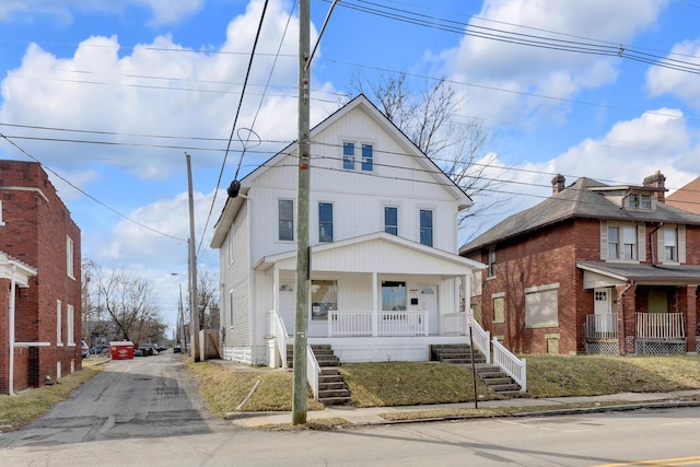 traditional style home with stairs and a porch