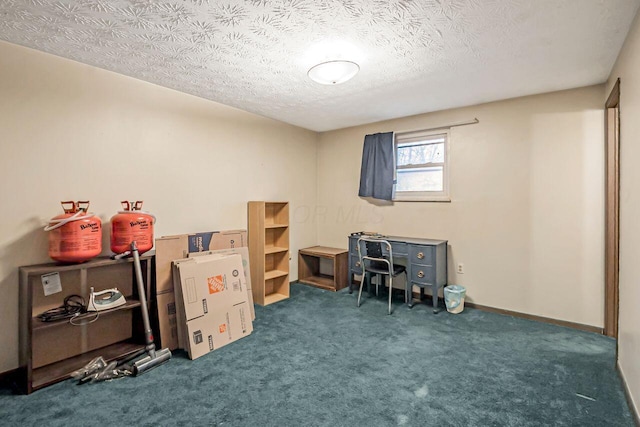 interior space with baseboards, dark carpet, and a textured ceiling