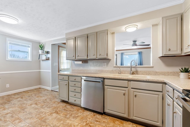 kitchen featuring a sink, a ceiling fan, light countertops, dishwasher, and crown molding