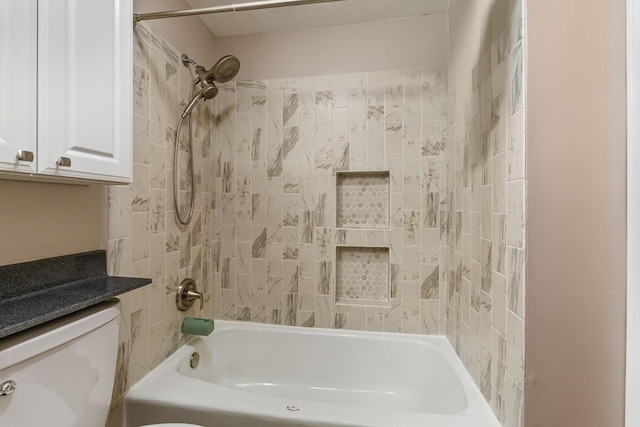 bathroom featuring shower / bathtub combination and toilet