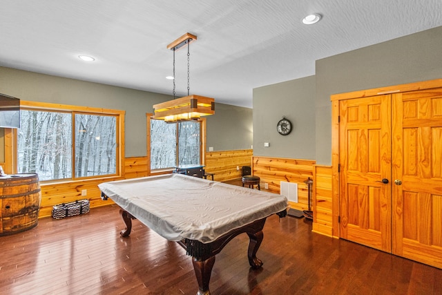 recreation room with hardwood / wood-style flooring, a textured ceiling, wooden walls, and billiards