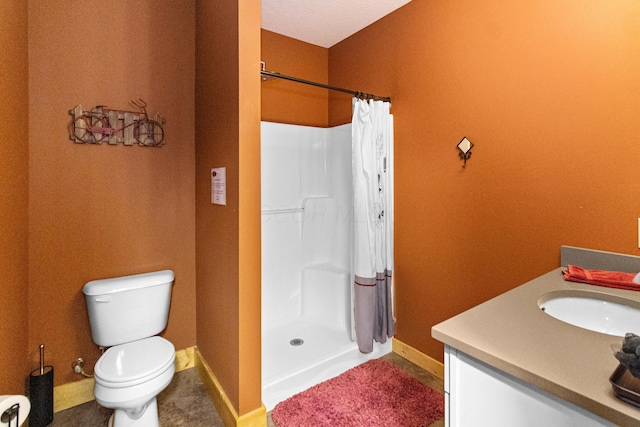 bathroom with vanity, toilet, and a shower with shower curtain