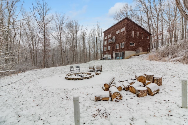 view of yard layered in snow