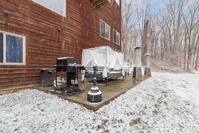 snow covered patio with grilling area