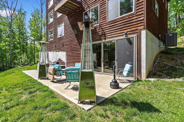18004 Buckingham Rd, Logan, OH 43138 - rear view of house with a patio area, central AC, and a lawn