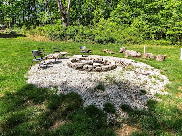 18004 Buckingham Rd, Logan, OH 43138 - view of green lawn featuring a fire pit and a view of trees