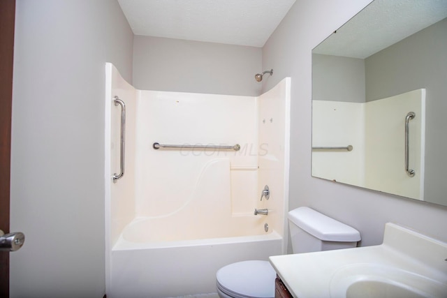 full bathroom with vanity, a textured ceiling, shower / washtub combination, and toilet