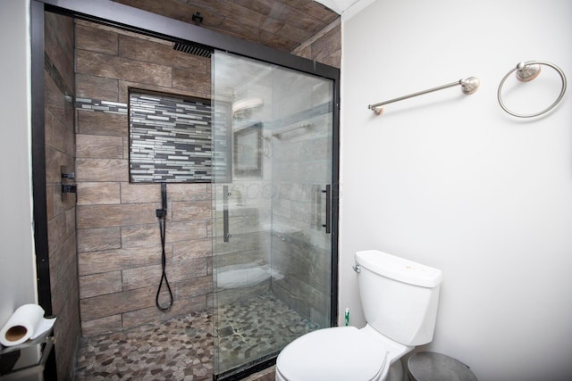 bathroom with toilet and walk in shower